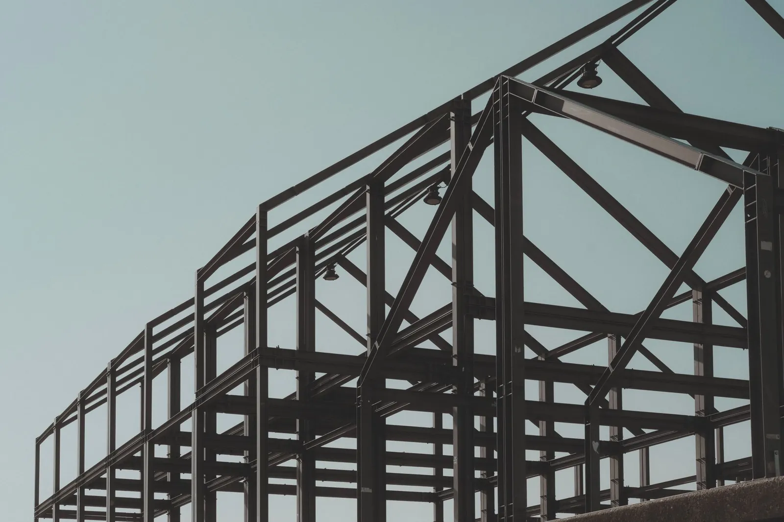 Steel frame of a pre-engineered building standing before walls and roof go on.